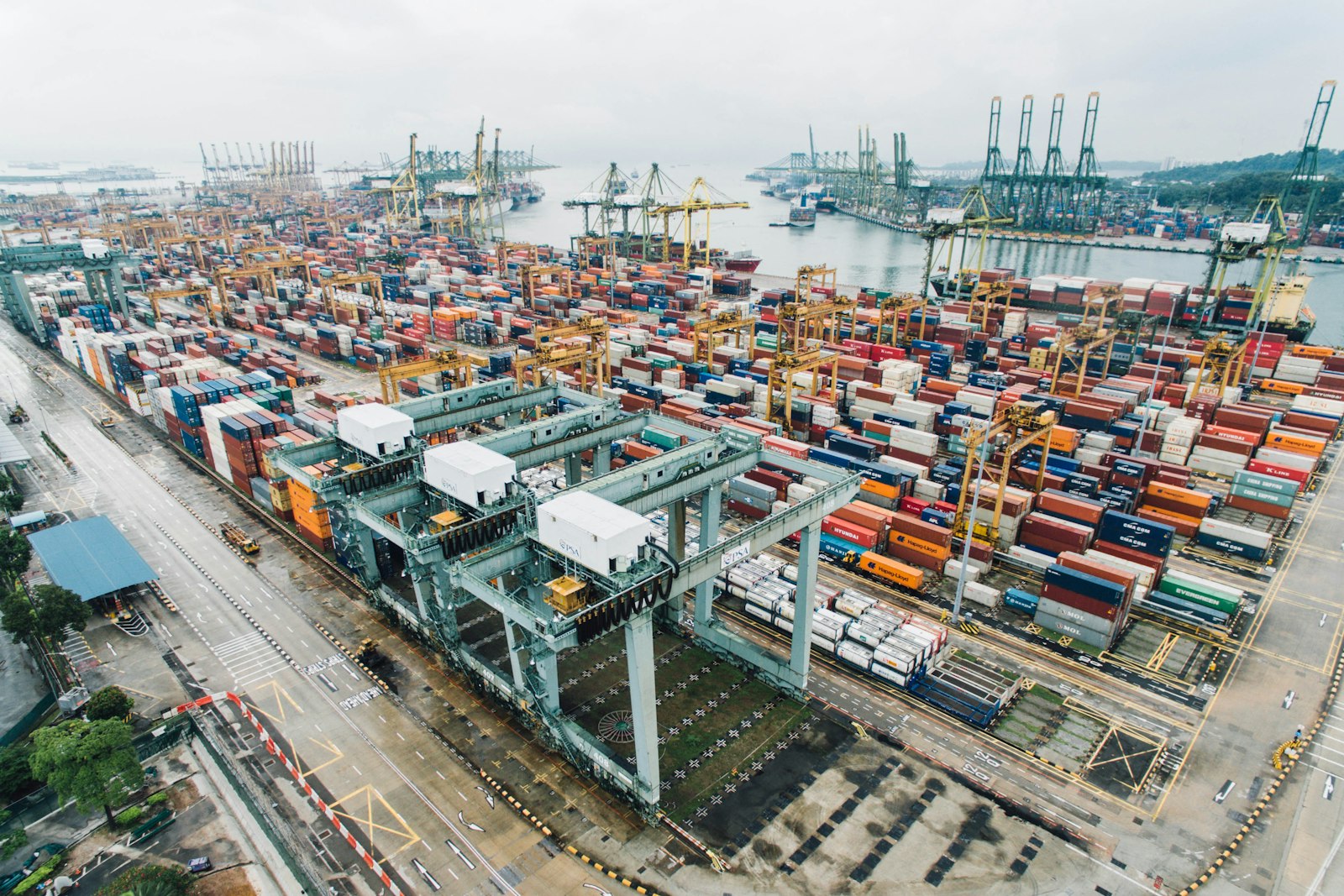 Shipping containers and cranes at an export port terminal